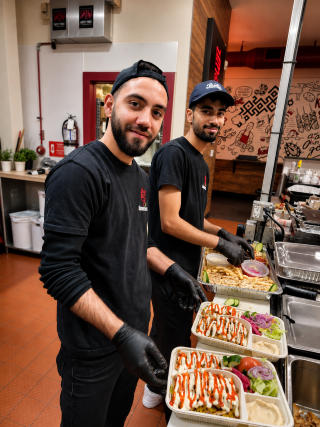 Kitchen team preparing fresh shawarma orders