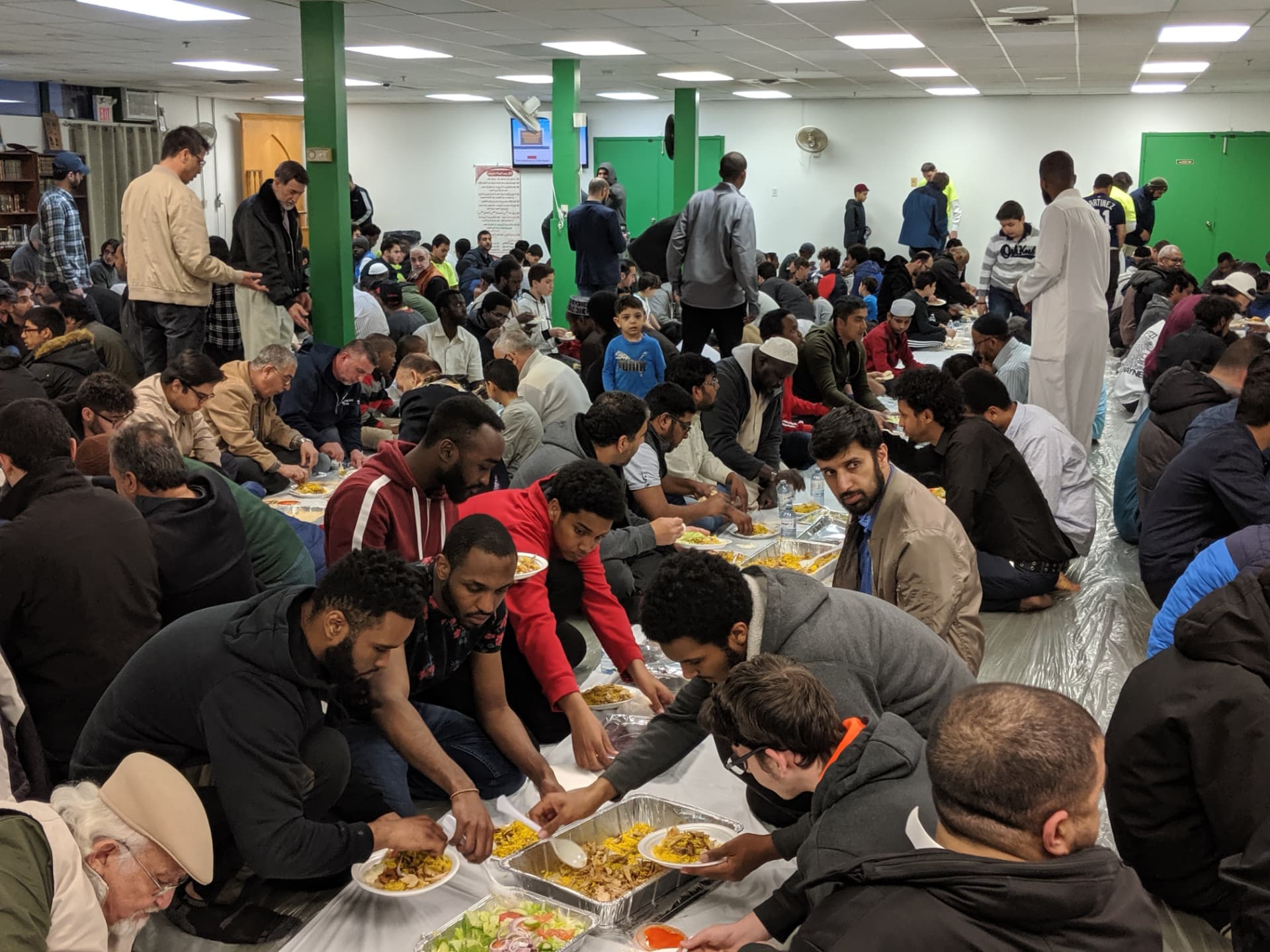 A fully sponsored community Iftar with more than one thousand people sharing food prepared by Shawerma Plus